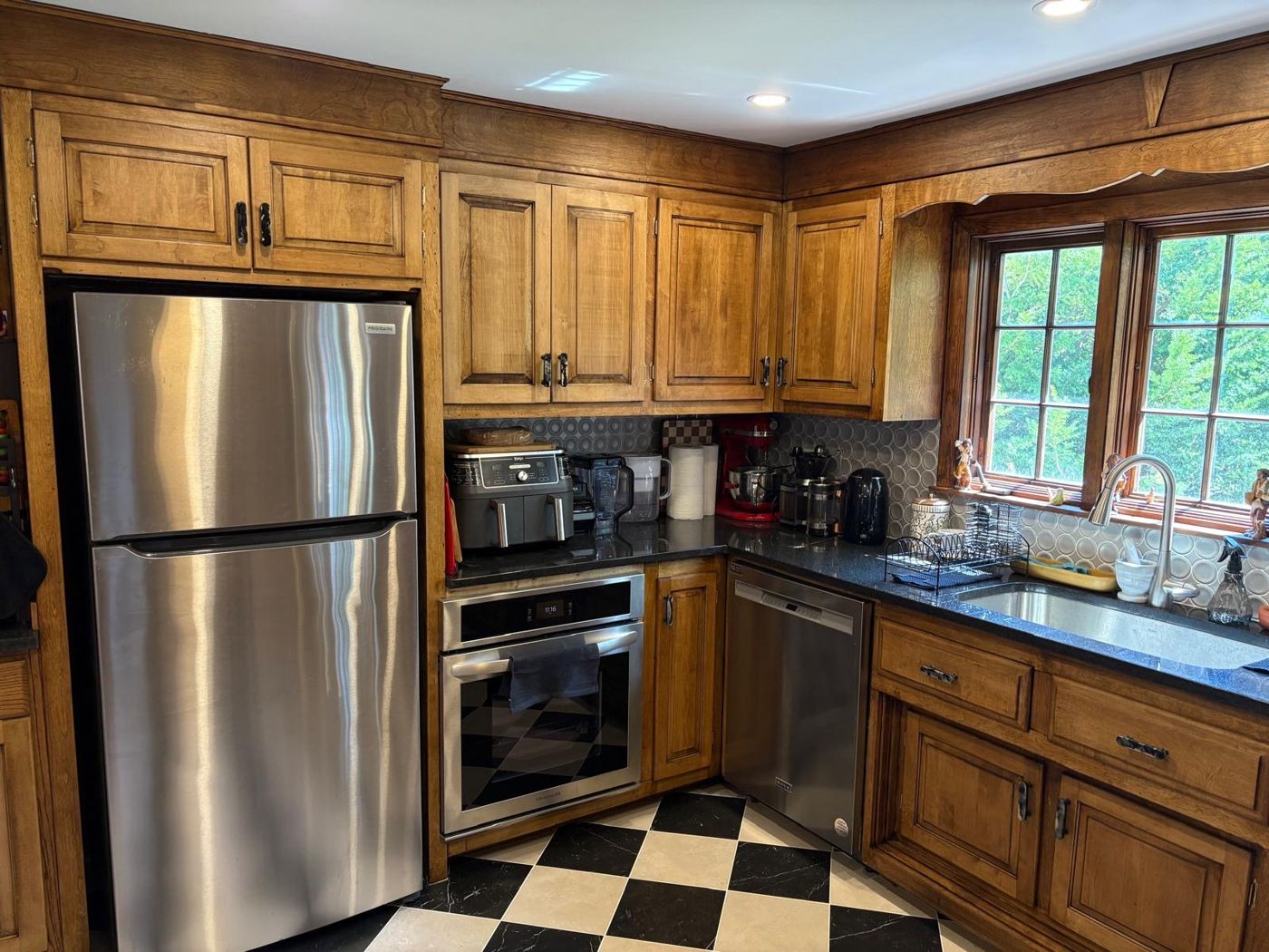 Finished cabinets by the refrigerator